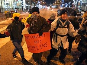 Jasper Avenue at 104 Street was closed to traffic for about an hour when a round dance was held by about 100 people on Friday January 10, 2020. The round dance was held to oppose the use of legal injunctions, police forces, and criminalizing state tactics against the Wet'suwet'en Nation asserting their own laws on their own lands. Wet'suwet'en Nation has been opposing the construction of Coastal GasLink, an LNG pipeline, on its unceded traditional territories since it was first proposed in 2012.