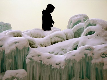 An employee at the Ice Castles installation in Edmonton's Hawrelak Park works in the -27C degree temperatures on Thursday January 16, 2020.