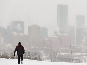 A bundled up walker braves a daytime temperature of -25 degrees Celcius while exercising at Strathearn Park in Edmonton, on Thursday, Jan. 16, 2020.