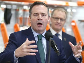 Alberta Premier Jason Kenney gestures as he speaks at Arn's Equipment in Calgary on Tuesday, January 21, 2020. Kenney and Associate Minister Grant Hunter (R) spoke regarding red tape reduction a long time local business.