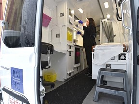RN Louise Rackel going through medical supplies on the new Boyle McCauley Mobile Health Clinic for underserved communities, outside The Mustard Seed at a official announcement for the expansion of the innovative TELUS Health for Good™ program in Edmonton, January 22, 2020. Ed Kaiser/Postmedia