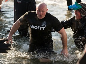 Edmonton Police Service Recruit Class 147 members take a dip in icy water for Special Olympics during the 2020 Polar Plunge at Lake Summerside in Edmonton, on Sunday, Jan. 26, 2020 in support of the Law Enforcement Torch Run (LETR) for Special Olympics Alberta.