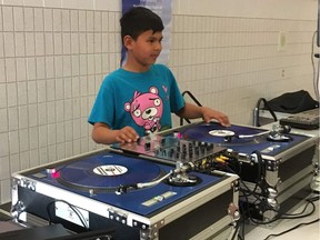 A student takes part in a beat-making workshop for kids at Kinistin Saulteaux Nation in Saskatchewan in 2019. Edmonton DJ Derek Allen is returning on Feb. 1, 2020 to put on another DJ clinic.