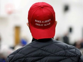 A supporter attends a rally for Wexit Alberta rally in Calgary. The province is exploring withdrawing from the Canadian Pension Plan.