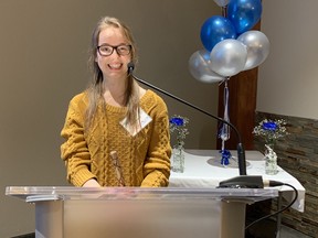 Amanda Burt, 21, speaks Thursday evening at the Catholic Social Services Sign of Hope event.