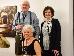 Clarinet-and-saxaphone-playing Steve Banszky and his percussionist wife Klara fled Budapeast at the height of the 1956 Hugarian Uprising, found their way to Edmonton five months later and now often play with a band giving a concert for a charity or seniors. They are pictured here on New Year's Eve at Canterbury Court seniors' home with their daughter Melinda, born soon after they reached Edmontion.