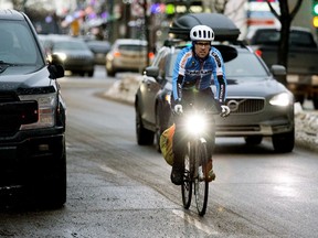 Aaron Schooler of the Alberta Cycling Coalition rides down 124 Street near 102 Avenue on Wednesday, Jan. 29, 2020.