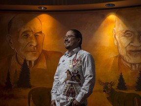 Grand Chief Billy Morin, the youngest ever Chief of Enoch Cree Nation and now newly appointed Grand Chief of Treaty 6 on January 28, 2020. Behind him are his great great grandfather Alexis Morin and his great grandfather Billy Morin, both former Enoch Chiefs. Photo by Shaughn Butts / Postmedia