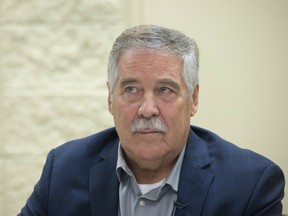 George Cook, president of the Riverview Estates condominium corporation board, speaks at a news conference on Monday, Jan. 27, 2020, in Fort Saskatchewan.