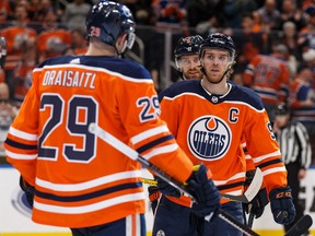 Edmonton Oilers teammates Leon Draisaitl, left, and Connor McDavid (97) celebrate the former's power play goal on an empty net against the Nashville Predators during NHL action at Rogers Place in Edmonton on Jan. 14, 2020.