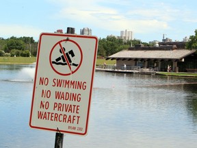 A no swimming sign at the Hawrelak Park pond. File photo.