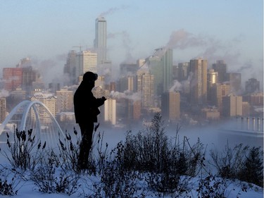 Robert Thompson takes photos of the frigid Edmonton skyline with a medium format film camera, in Edmonton Tuesday Jan. 14, 2020. Thompson had been using digital cameras but the batteries kept dying in the cold. Environment Canada has issued an extreme cold warning for the city.