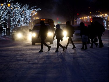 Pedestrians walk through the frigid morning air near 82 Avenue and 105 Street, in Edmonton Thursday Jan. 16, 2020.