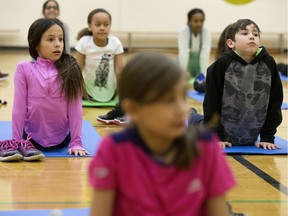 Grade 4, 5, and 6 students take part in the lunchtime yoga club at Sweet Grass School, 11351 31 Ave., in Edmonton Tuesday Jan. 21, 2020.