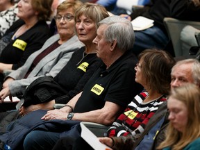 Opponents of an affordable housing project in Keheewin wearing KRRD are seen at an Edmonton City Council meeting at City Hall in Edmonton, on Tuesday, Jan. 21, 2020. Photo by Ian Kucerak/Postmedia