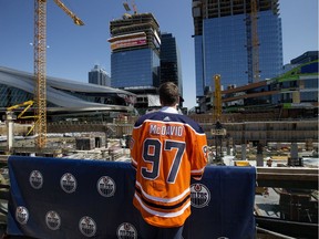 The Edmonton Oilers' Connor McDavid looks out at the construction on the Ice District in 2017.