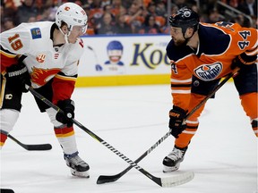 The Edmonton Oilers' Zack Kassian (44) has words with the Calgary Flames' Matthew Tkachuk (19) moments before the pair fought during first period NHL action at Rogers Place, in Edmonton Wednesday Jan. 29, 2020.
