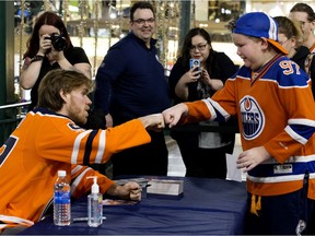 Matthew Thibaudeau, 10, breaks into tears as he meets the Edmonton Oilers' Connor McDavid, following an Oilers open practice inside West Edmonton Mall, in Edmonton Monday Jan. 27, 2020. Thibaudeau was the first to meet McDavid of the hundreds that lined up to get an autograph. Photo by David Bloom