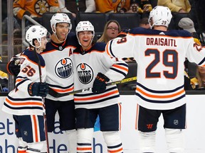 Edmonton Oilers defenseman Darnell Nurse (25) celebrates with teammates after scoring a goal against the Boston Bruins during the second period at TD Garden. Mandatory Credit: Winslow Townson-USA TODAY Sports