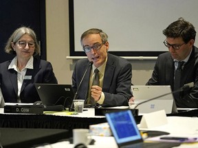 Kathy Penney, left, Damien Cote and Mark Watton of the Commission of the Canada Energy Regulator at a Trans Mountain pipeline route hearing in Spruce Grove on Jan. 28, 2020.