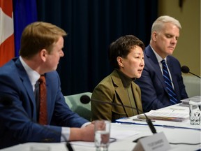 From Left; Tyler Shandro, Alberta Minister of Health, Dr. Verna Yiu, AHS president and CEO, and John Bethel, Ernst & Young LLP, take part in a news conference at McDougall Centre in Calgary on Monday, February 3, 2020. Azin Ghaffari/Postmedia