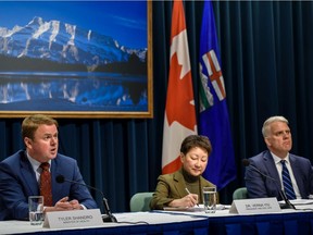 From Left; Tyler Shandro, Alberta Minister of Health, Dr. Verna Yiu, AHS president and CEO, and John Bethel, Ernst & Young LLP, take part in a news conference at McDougall Centre in Calgary on Monday, Feb. 3, 2020. Azin Ghaffari/Postmedia