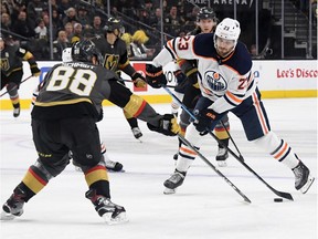 Riley Sheahan #23 of the Edmonton Oilers shoots against Nate Schmidt #88 of the Vegas Golden Knights in the first period of their game at T-Mobile Arena on February 26, 2020 in Las Vegas, Nevada. The Golden Knights defeated the Oilers 3-0.