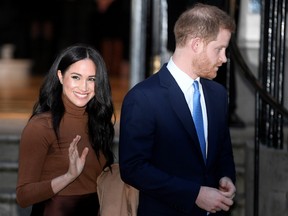 Britain's Prince Harry and his wife Meghan, Duchess of Sussex, leave Canada House in London.