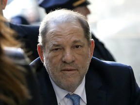 Harvey Weinstein, former co-chairman of the Weinstein Co., center, arrives with his attorney Donna Rotunno, left, at state supreme court in New York, U.S., on Monday, Feb. 24, 2020.