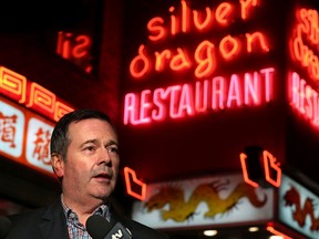 Alberta Premier Jason Kenney stops to talk with media before having dinner in the Silver Dragon restaurant in Calgary's Chinatown on Saturday, February 1, 2020. The premier was hoping to reassure Albertans that the risk from the coronavirus is still very low. Gavin Young/Postmedia