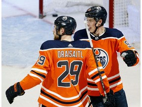 Leon Draisaitl celebrates his game winning open net goal against the Chicago Black Hawks with team mate Ryan Nugent-Hopkins in Edmonton on February 11, 2020. The Oilers defeated the Black Hawks 5-3.