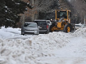 A grader at work near 87 Avenue during the first day back of the residential blading after it was suspended due to weather on Friday, Feb. 14, 2020.