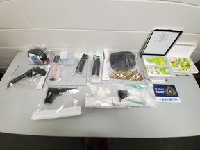 St. Paul RCMP have arrested one man and recovered a stolen .22 caliber handgun, drugs, bear spray, an imitation handgun, a cross bow and ammunition after executing a search warrant on Saddle Lake First Nation on Feb. 13, 2020. (Supplied photo/RCMP)