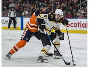 Adam Larsson (6) of the Edmonton Oilers, tries to slow down Anders Bjork of the Boston Bruins at Rogers Place on Wednesday, Feb. 19, 2020.