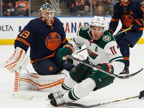 Edmonton Oilers goaltender Mikko Koskinen (19) stops Minnesota Wild's Zach Parise (11) during second period NHL action at Rogers Place in Edmonton, on Friday, Feb. 21, 2020.