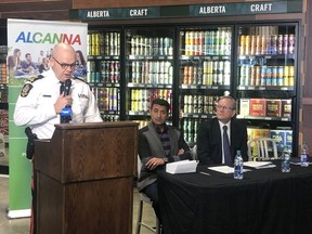 Chief Dale McFee,left, speaks to media alongside Edmonton Police Foundation Chair Ashif Mawji and Alcanna Chair and CEO James Burns. Alcanna has put $500,000, including a $250,000 prize for entrepreneurs, to help curb liquor store thefts.