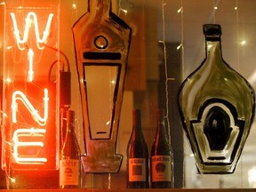 Wines by winemaker Eric Texier are seen on the window sill at Color de Vino.