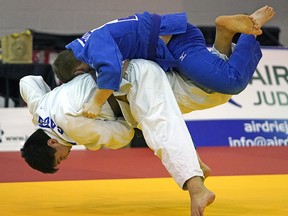 Shion Crook (Okotoks) throws Christopher Hronopoulos (Edmonton) in judo action at the 2020 Alberta Winter Games in Airdrie, Alberta on Sunday February 16, 2020. Crook won the match. (PHOTO BY LARRY WONG/POSTMEDIA)
