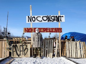 Supporters of the indigenous Wet'suwet'en Nation's hereditary chiefs camp at a railway blockade as part of protests against British Columbia's Coastal GasLink pipeline, in Edmonton, Alberta, Canada February 19, 2020. REUTERS/Codie McLachlan