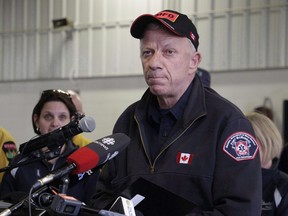 Fort McMurray fire chief Darby Allen speaks to members of the media at a fire station in Fort McMurray, Monday, May 9, 2016. The former Fort McMurray fire chief hailed by some as a hero for his role in battling a massive 2016 wildfire has been accused of sexually harassing a female subordinate during his previous job in Calgary's fire department.