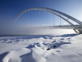 Fog rises from the North Saskatchewan River past the Walterdale Bridge, in Edmonton Tuesday Feb. 18, 2020.