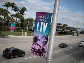 A banner advertising Super Bowl LIV between the San Francisco 49ers and the Kansas City Chiefs is displayed next to Hard Rock Stadium in Miami Gardens, Florida, on Jan. 30, 2020.