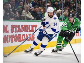 Tampa Bay Lightning left winger Patrick Maroon (14) is pursued by Dallas Stars centre Radek Faksa (12) at the American Airlines Center on Jan. 27, 2020.