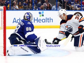 Feb 13, 2020; Tampa, Florida, USA; Edmonton Oilers right wing Alex Chiasson (39) shoots as Tampa Bay Lightning goaltender Andrei Vasilevskiy (88) defends the puck during the second period at Amalie Arena. Mandatory Credit: Kim Klement-USA TODAY Sports ORG XMIT: USATSI-405875