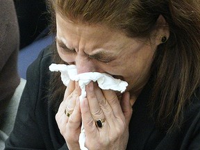 A mourner grieves during a memorial held at city hall on Saturday February 22, 2020. The Iranian Heritage Society of Edmonton paid tribute to the members of their community who perished in the crash of Ukraine International Airlines Flight 752 on January 8, 2020 when it was shot down by the military in Iran. The aircraft was carrying 176 people, including nine crew members and 15 children. There were a total of 63 Canadians on board, including 13 passengers from Edmonton. (PHOTO BY LARRY WONG/POSTMEDIA)