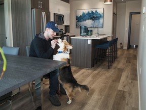 Jared Moss and his dog Naz at Central Tower in Century Park.