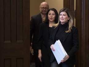 Rona Ambrose, Women and Gender Equality and Rural Economic Development Minister Maryam Monsef and Minister of Justice and Attorney General of Canada David Lametti make their way to speak in the Foyer of the House of Commons in Ottawa, Tuesday Feb. 4, 2020.