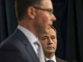 Jobs, Economy and Innovation Minister Doug Schweitzer, left, with Premier Jason Kenney.