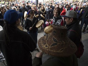 Demonstrators gather outside the Coastal GasLink offices in downtown Vancouver, on Wednesday.