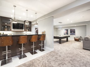 The lower level rec room can be transformed with a built-in bar and room for games like pool.
